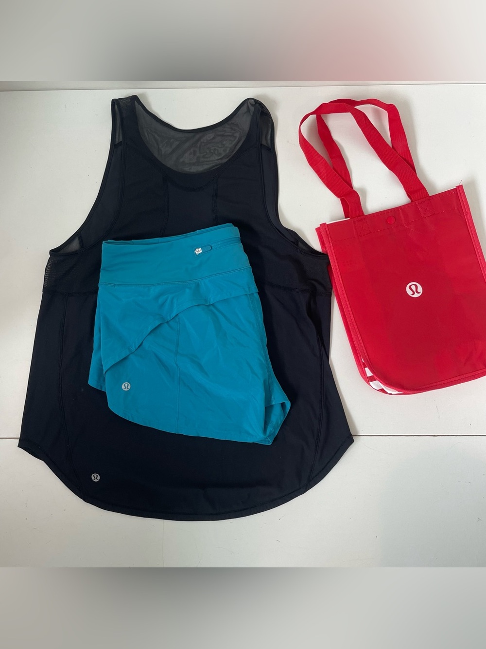 Bundle 2 Lululemon Women’s size 10 Black Tank and Blue Short inseam 4”